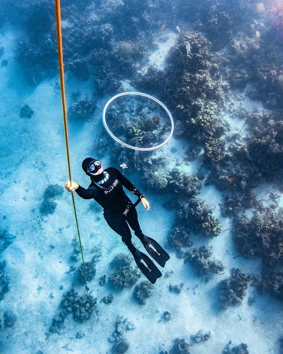 Freediver making a bubble ring